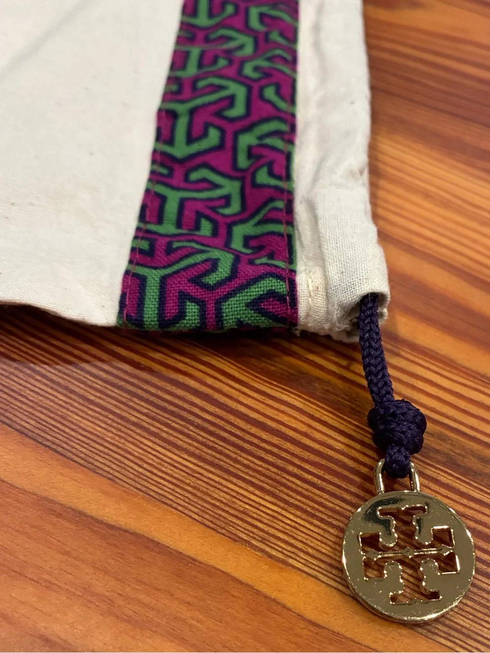 Tory Burch Cream Dust Bag with Purple & Green Trim and Gold Logo Charm
